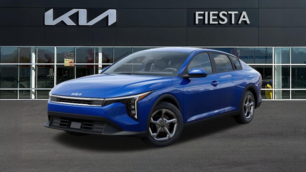 2026 Kia K4 LXS in Deep Sea Blue — front three-quarter view