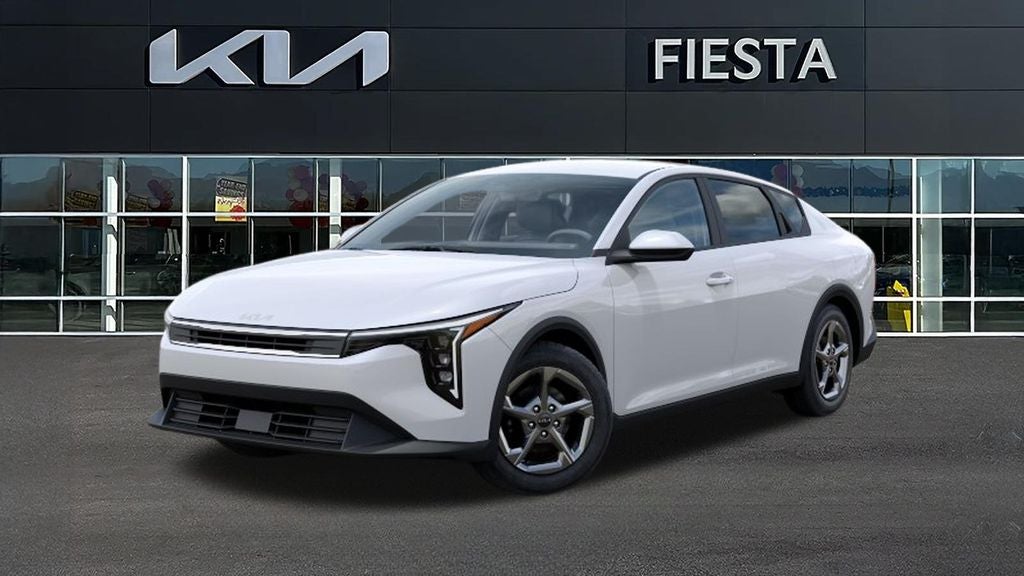 2026 Kia K4 LXS in Snow White Pearl — front three-quarter view