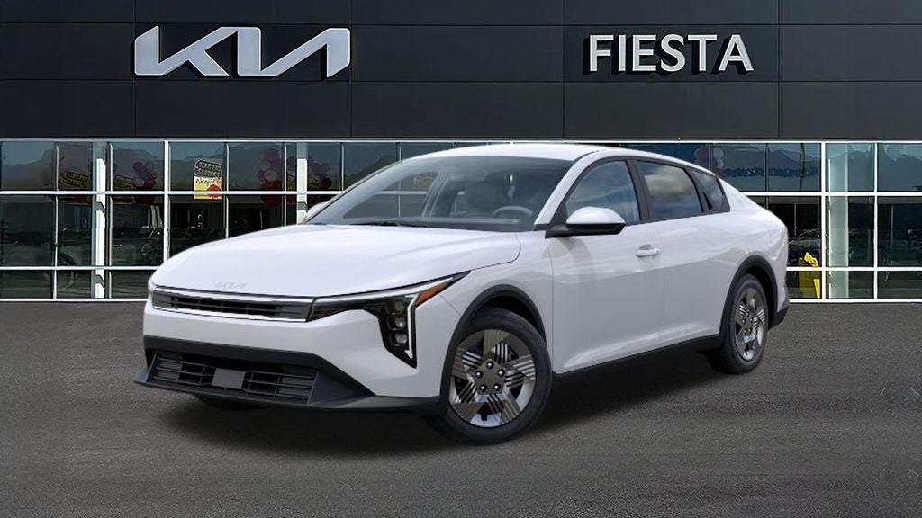 2026 Kia K4 LX in Snow White Pearl — front three-quarter view