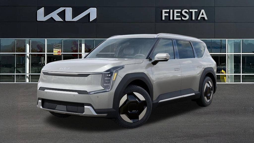 2026 Kia EV9 Wind in Ivory Silver — front three-quarter view