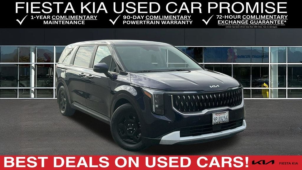 2025 Kia Carnival LXS in Deep Chroma Blue — front three-quarter view