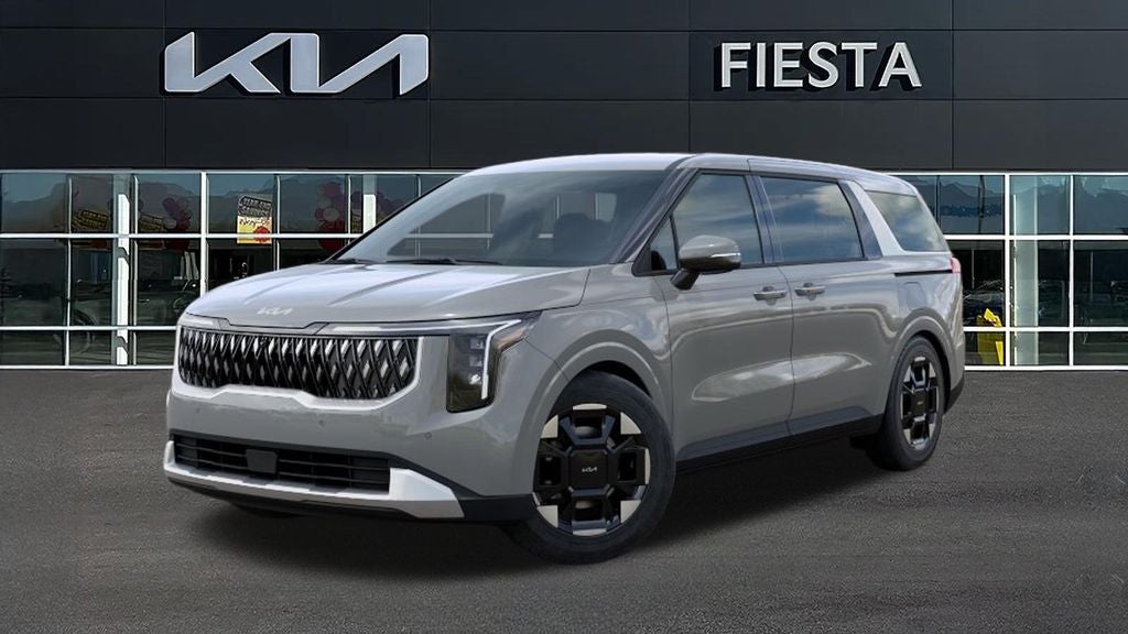 2026 Kia Carnival EX in Ceramic White — front three-quarter view