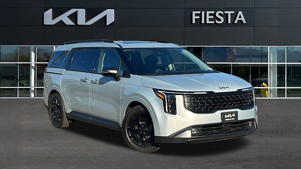 2026 Kia Carnival SX Prestige in Ivory Silver — front three-quarter view
